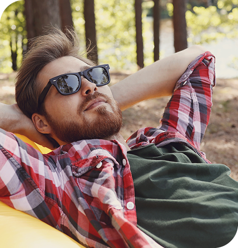 Man wearing sunglasses relaxing
